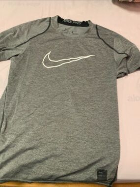 Nike grey Short Sleeve Dri-FIT Athletic Tee with White Swoosh